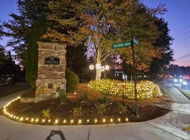 Subdivision entrance Subdivision entrance monument with pathway lights, shrub nets and light spheres
